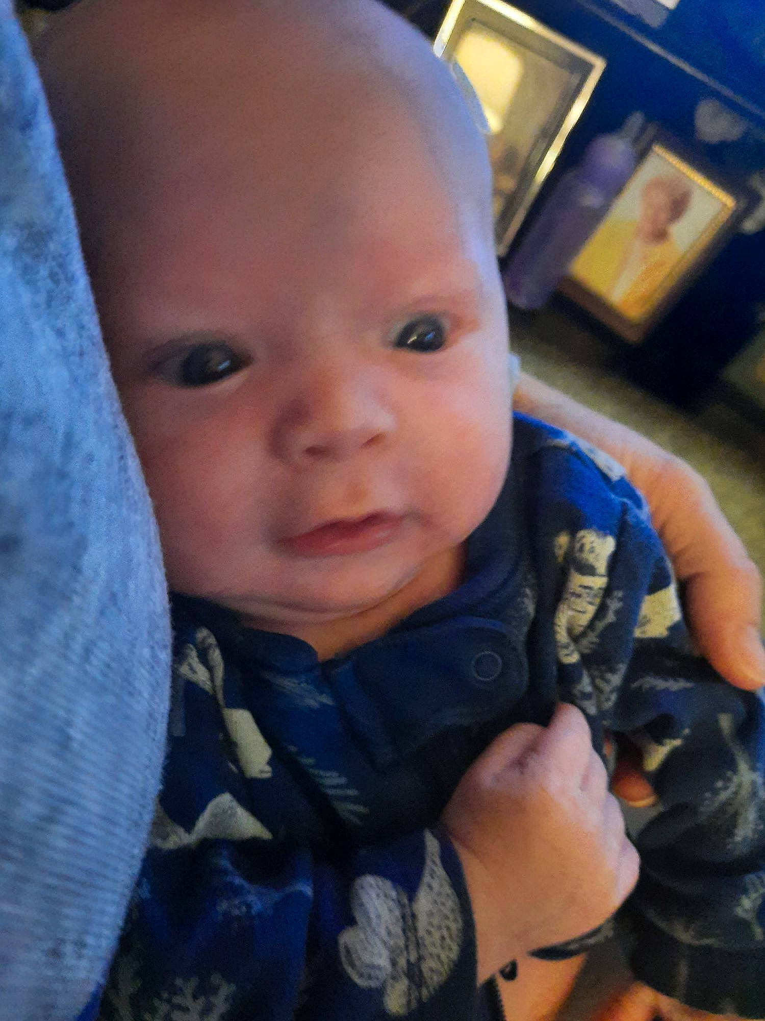 Evan is registered to the contest to win money with this photo: baby, baby_toddler_clothing, cheek, chin, cool, ear, eyebrow, finger, gesture, happy, iris, lip, mouth, nose, person, picture_frame, skin, sleeve, smile, thumb