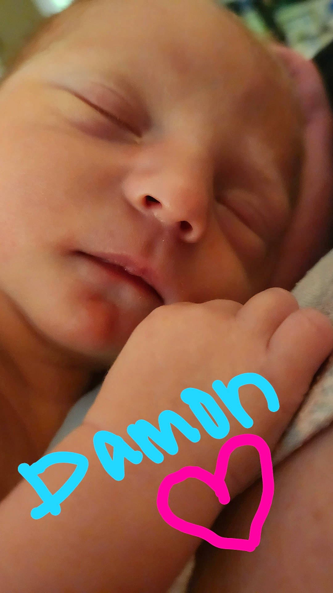 Damon is registered to the contest to win money with this photo: baby, beauty, cheek, close_up, comfort, eyelash, facial_expression, finger, gesture, hand, happy, lip, mouth, nail, nose, person, pink, skin, sweetness, thumb