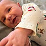 Westyn joined the competition — help win amazing prizes! applique, baby, babylaughing, blanket, bodypart, clothing, face, finger, hand, happy, head, newborn, pajamas, pattern, person, photography, portrait, quilt, smile, wrist