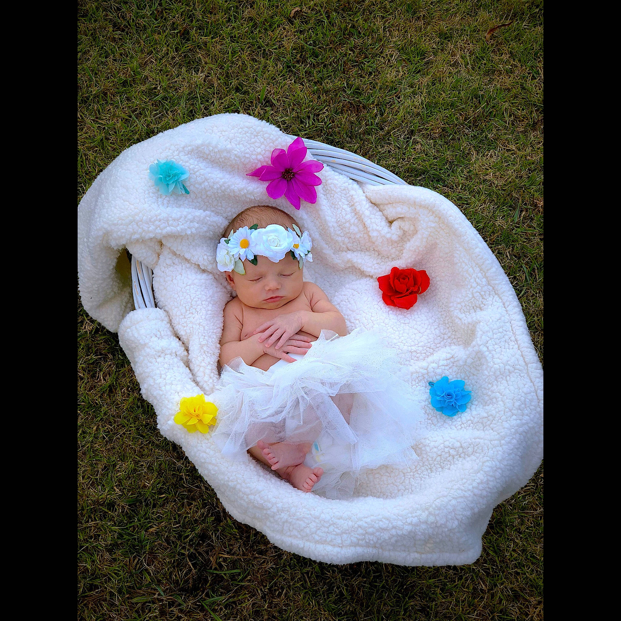 Laylah is registered to the contest to win money with this photo: baby, baby_products, beauty, child, grass, hair_accessory, head, headgear, headwear, person, petal, photography, pink, plant, product, sitting, toddler, white