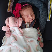 Jazmine Serenity joined the competition — help win amazing prizes! baby, sleeping, car_seat, pink_headband, plush_elephant, blanket, infant, child, cute, peaceful, soft_toy, cozy, resting, wrapped, toddler, clothing, indoor, seat, head, face