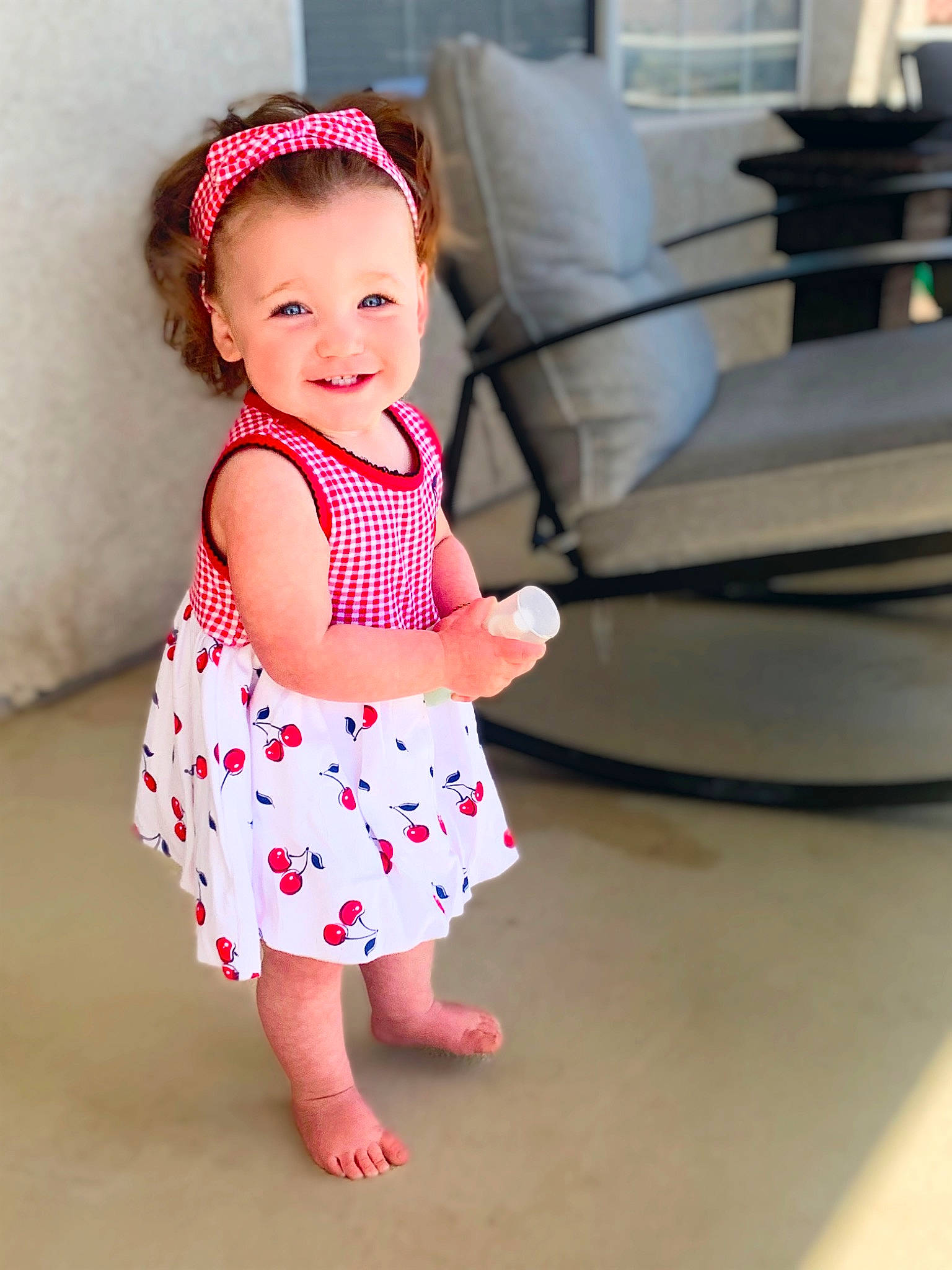 Madalynn is registered to the contest to win money with this photo: baby, baby_toddler_clothing, barefoot, child, day_dress, dress, face, fun, happy, human_leg, joy, magenta, neck, one_piece_garment, pattern, person, pink, skin, sleeve, smile