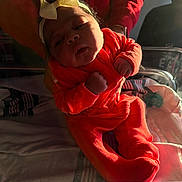 Dream joined the competition — help win amazing prizes! newborn, baby, infant, child, hospital, bassinet, onesie, headband, yellow_bow, orange_clothing, person, hands, blanket, soft_light, portrait, indoor, human, cute, small, sleepy