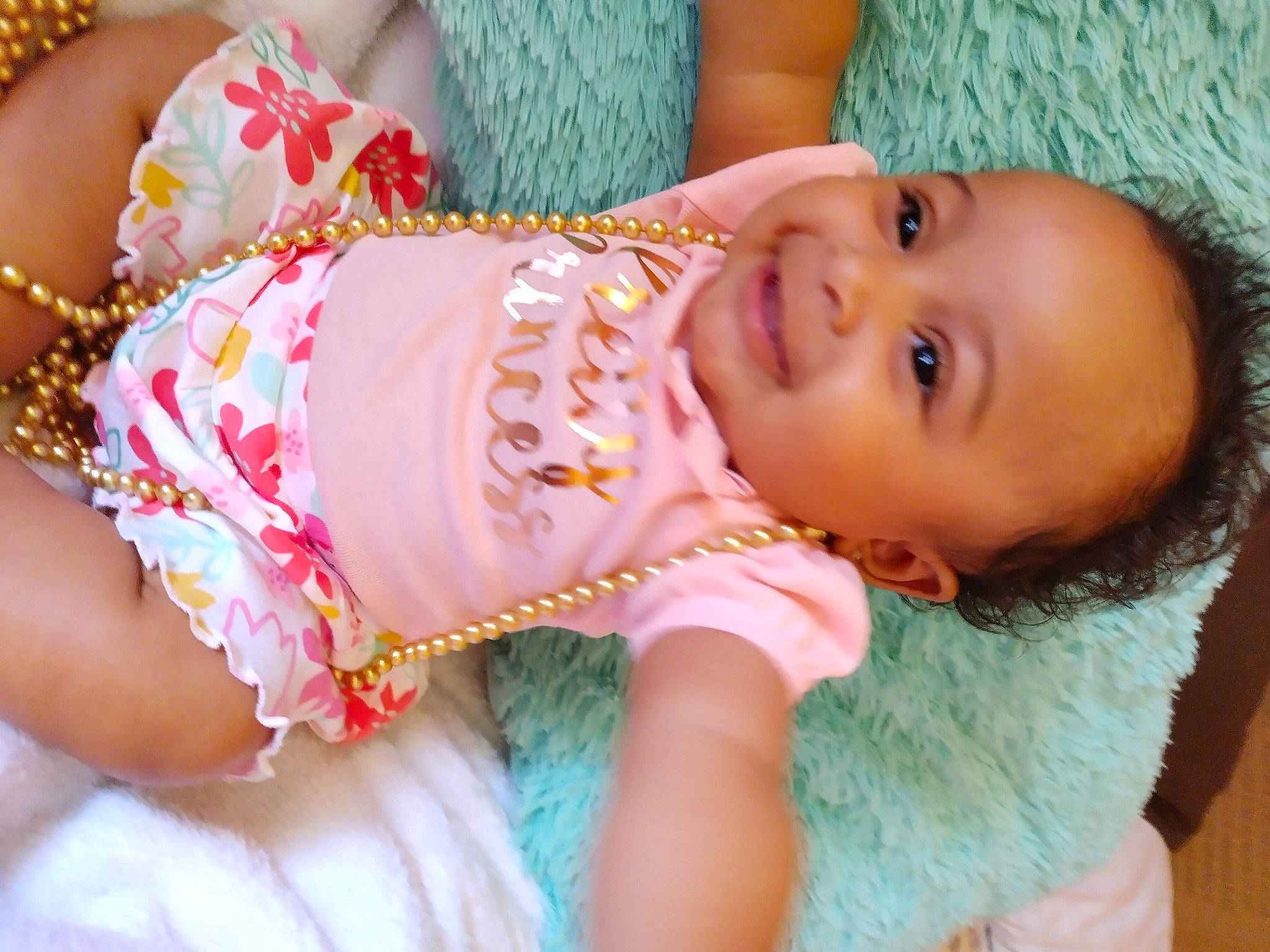 Giovanna is registered to the contest to win money with this photo: abdomen, baby, baby_toddler_clothing, black_hair, cheek, eye, eyelash, fun, happy, human_body, joy, lip, mouth, neck, nose, person, pink, skin, smile, thigh