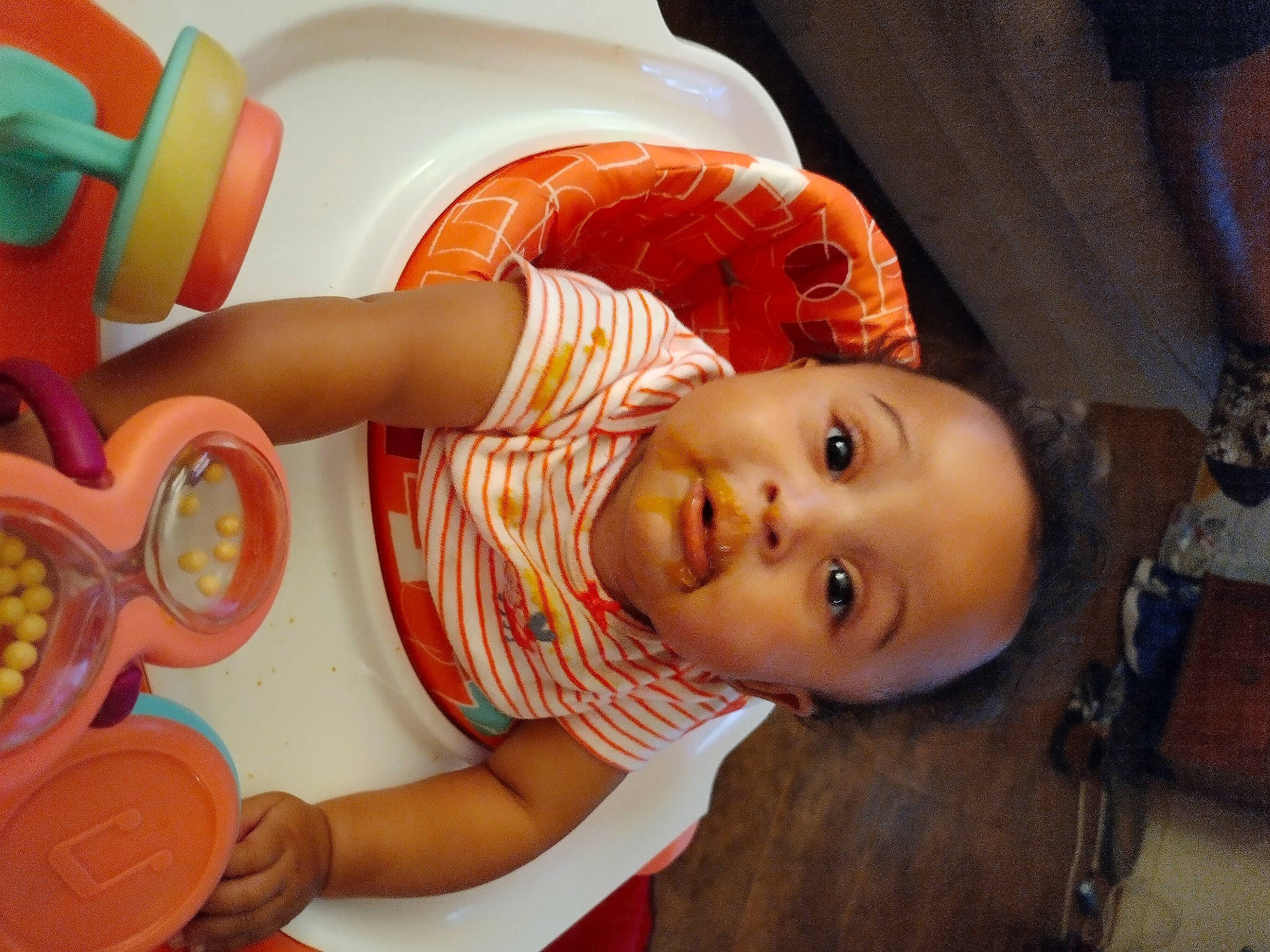 Giovanna joined the competition — help win amazing prizes! baby, baby_playing_with_toys, baby_toddler_clothing, chair, cheek, child, facial_expression, fun, hairstyle, happy, hat, mouth, nose, orange, organ, person, product, skin, tableware, toddler