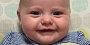 Evee joined the competition — help win amazing prizes! baby, smile, face, blue_eyes, plush_toys, striped_clothing, infant, closeup, soft_texture, cheeks, cute, happy, child, patterned_background, polka_dots, head, skin, person, indoors, cuddly