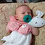 Ember is registered to the contest to win money with this photo: baby, bunny, child, comfort, cozy, cute, indoor, infant, mittens, pacifier, patterned_blanket, pink_clothing, plush_toy, portrait, quilt, resting, sleepwear, sleepy, soft_toy, young_child