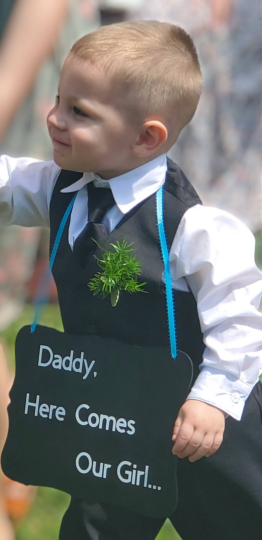 Daniel is registered to the contest to win money with this photo: child, collar, dress_shirt, electric_blue, event, formal_wear, gesture, grass, happy, jewellery, people_in_nature, person, photograph, school_uniform, sleeve, tie, toddler, tradition, tuxedo, uniform