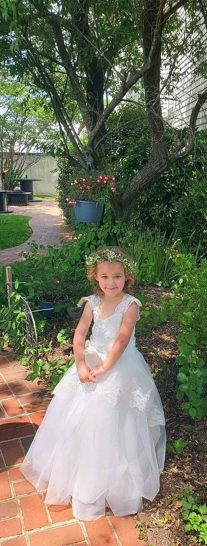 Ava joined the competition — help win amazing prizes! botany, bridal_accessory, bridal_clothing, clothing, day_dress, dress, embellishment, face, flower, gown, grass, hair, happy, head, headwear, joy, one_piece_garment, person, plant, smile