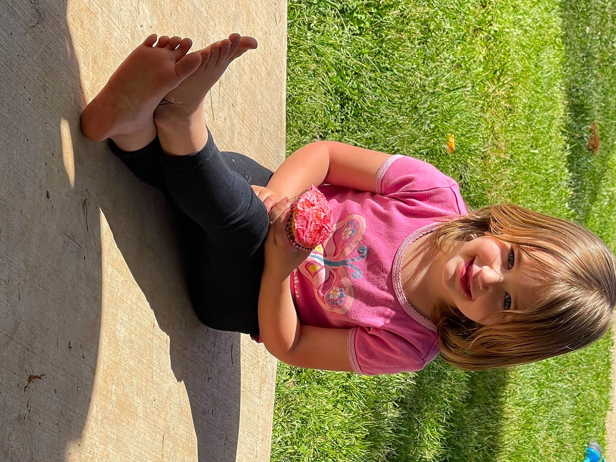 Ava is registered to the contest to win money with this photo: clothing, elbow, fun, gesture, grass, hair, hairstyle, happy, human_leg, joint, joy, knee, leisure, people_in_nature, person, plant, public_space, shoulder, smile, thigh