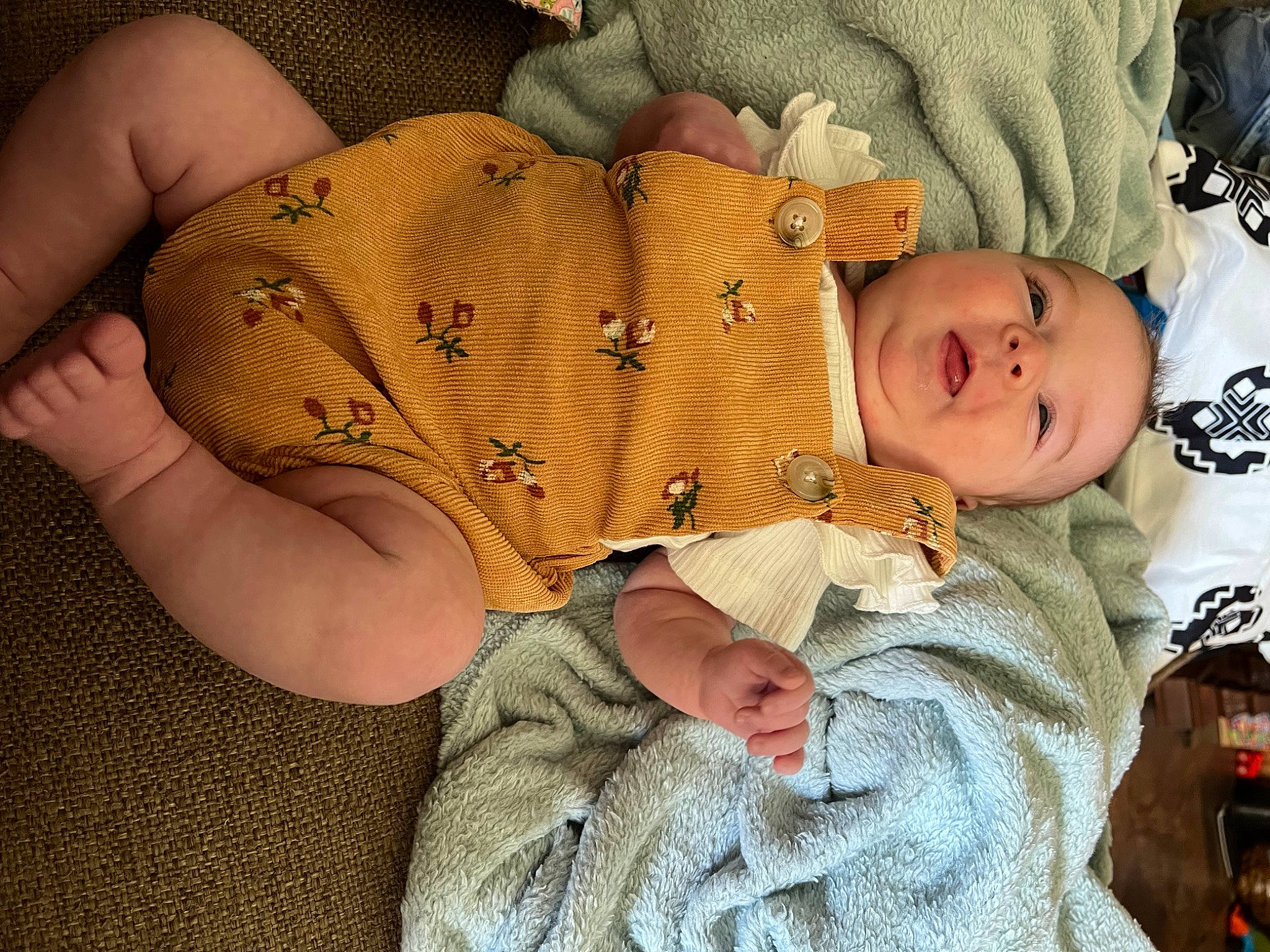 Wrenlee is registered to the contest to win money with this photo: abdomen, baby, baby_products, baby_toddler_clothing, child, comfort, finger, foot, fur, human_leg, linens, nail, pattern, person, skin, thigh, thumb, toddler, wood, wool