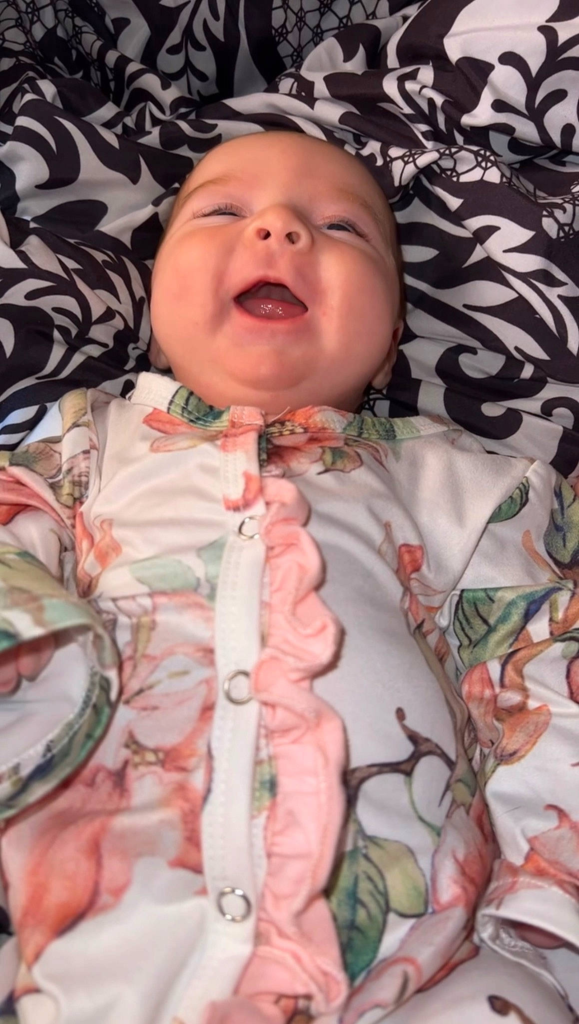 Wrenlee is registered to the contest to win money with this photo: baby, baby_toddler_clothing, cheek, child, comfort, eye, flesh, happy, headwear, linens, lip, mouth, neck, pattern, peach, person, pink, skin, sleeve, smile
