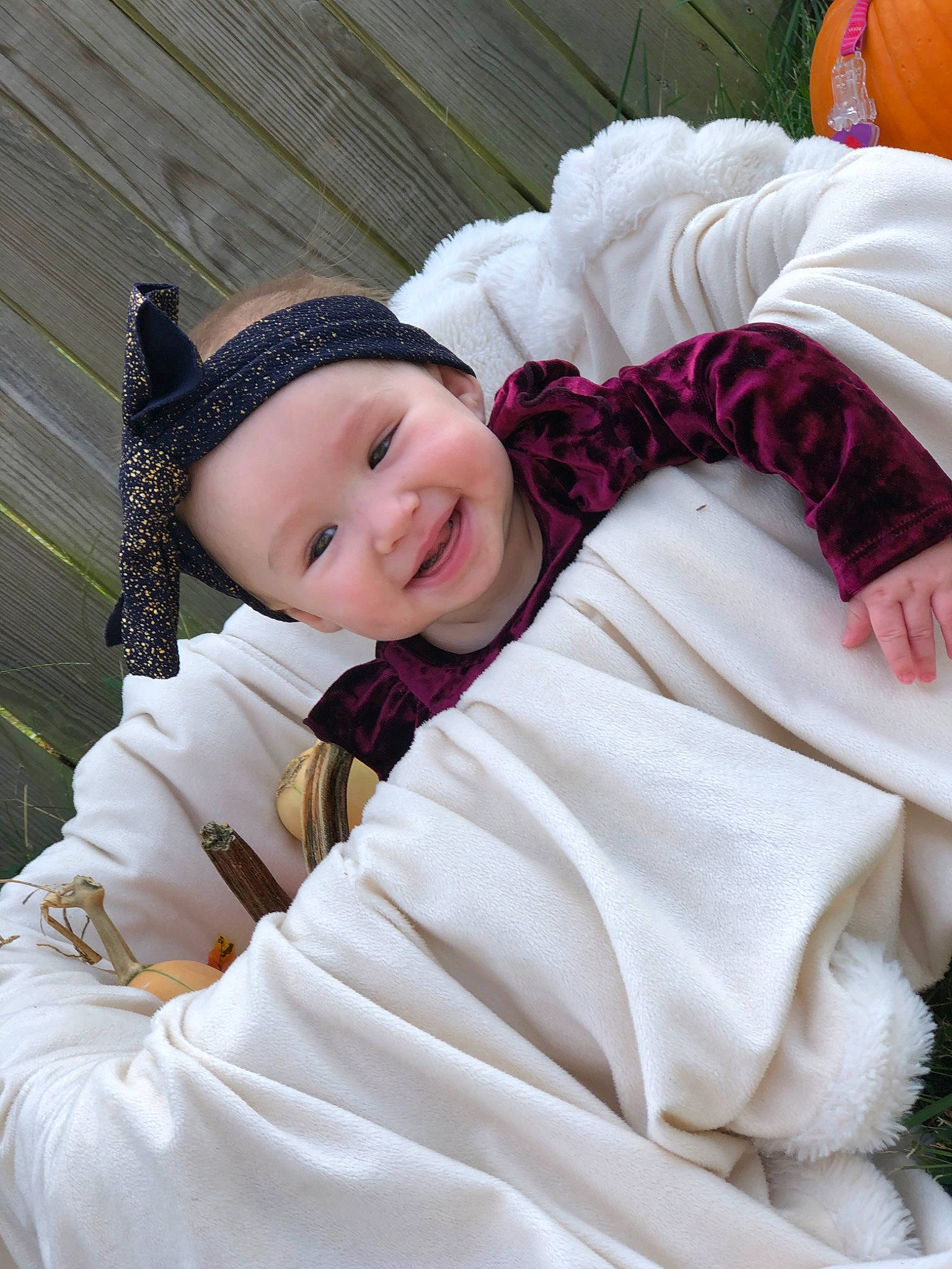Everlynn is registered to the contest to win money with this photo: baby, bonnet, cheek, child, eye, headgear, headwear, joy, person, pink, plant, skin, smile, toddler