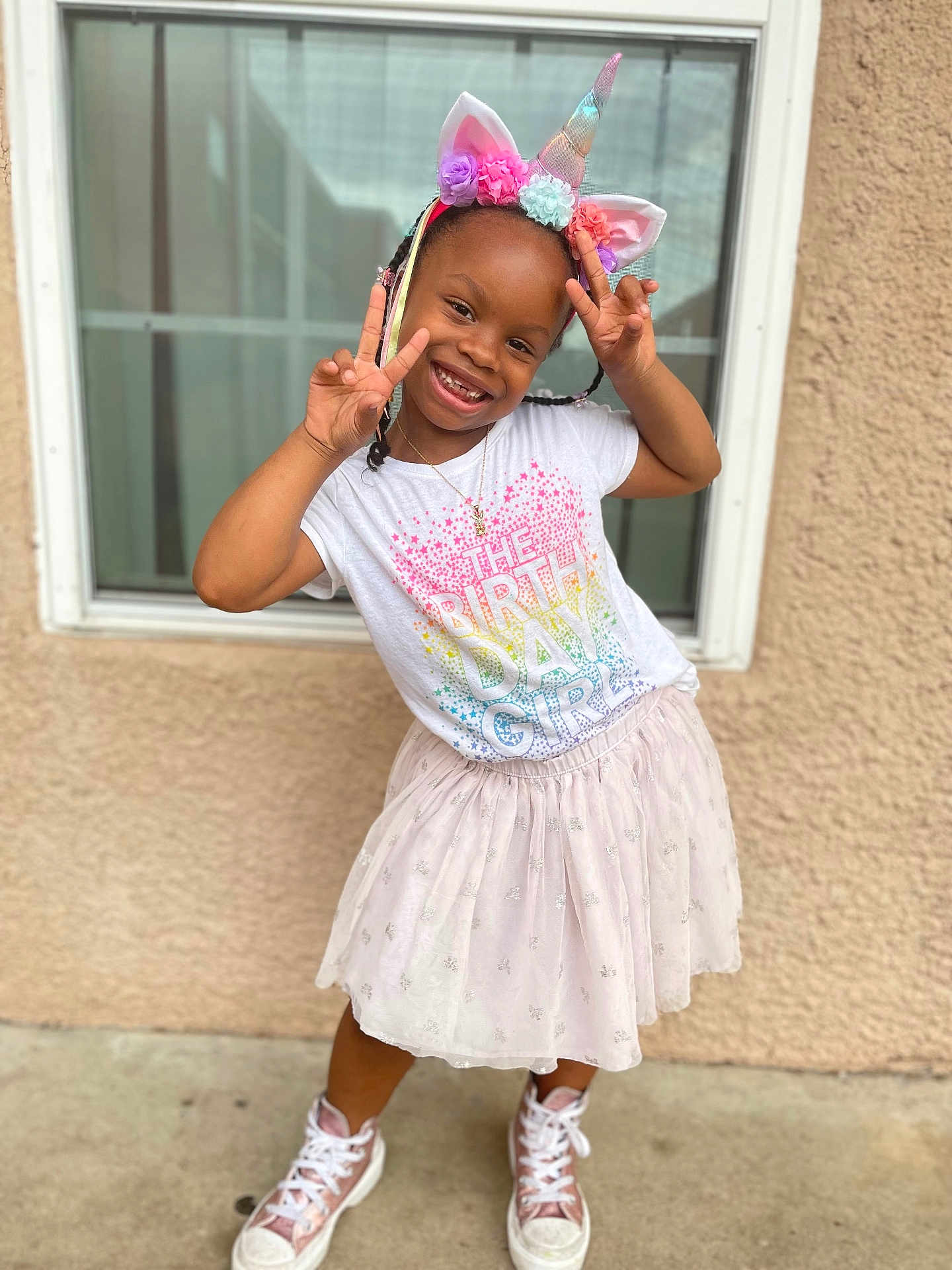 Zoey is registered to the contest to win money with this photo: accessories, child, clothing, face, female, footwear, girl, hair, head, jewelry, necklace, person, photography, portrait, racket, shoe, sitting, skirt, sleeve, sport