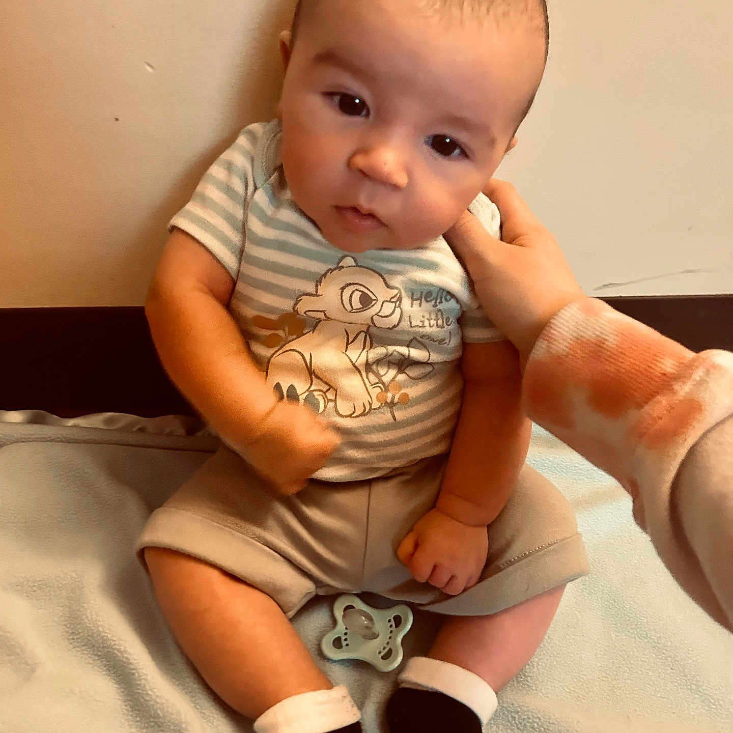 Romir is registered to the contest to win money with this photo: accessories, baby, bodypart, clothing, face, finger, footwear, hand, happy, head, pants, person, photography, portrait, shoe, shorts, sitting, sleeve, smile, t_shirt