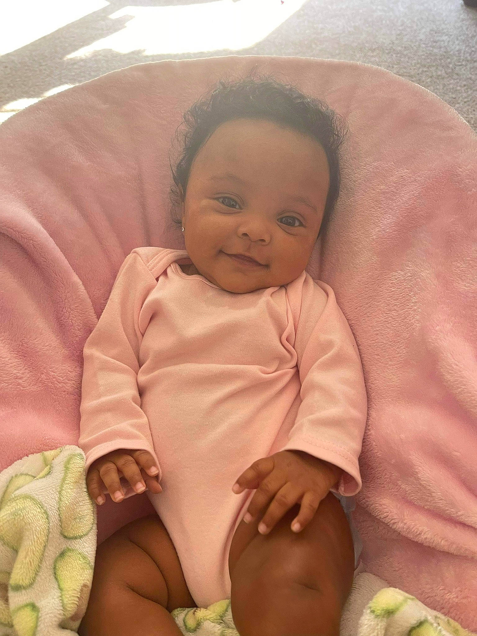 Amaia is registered to the contest to win money with this photo: baby, baby_products, baby_toddler_clothing, cheek, chin, comfort, fun, happy, head, human_body, linens, mouth, nose, person, skin, sleeve, smile, stomach, thigh, thumb