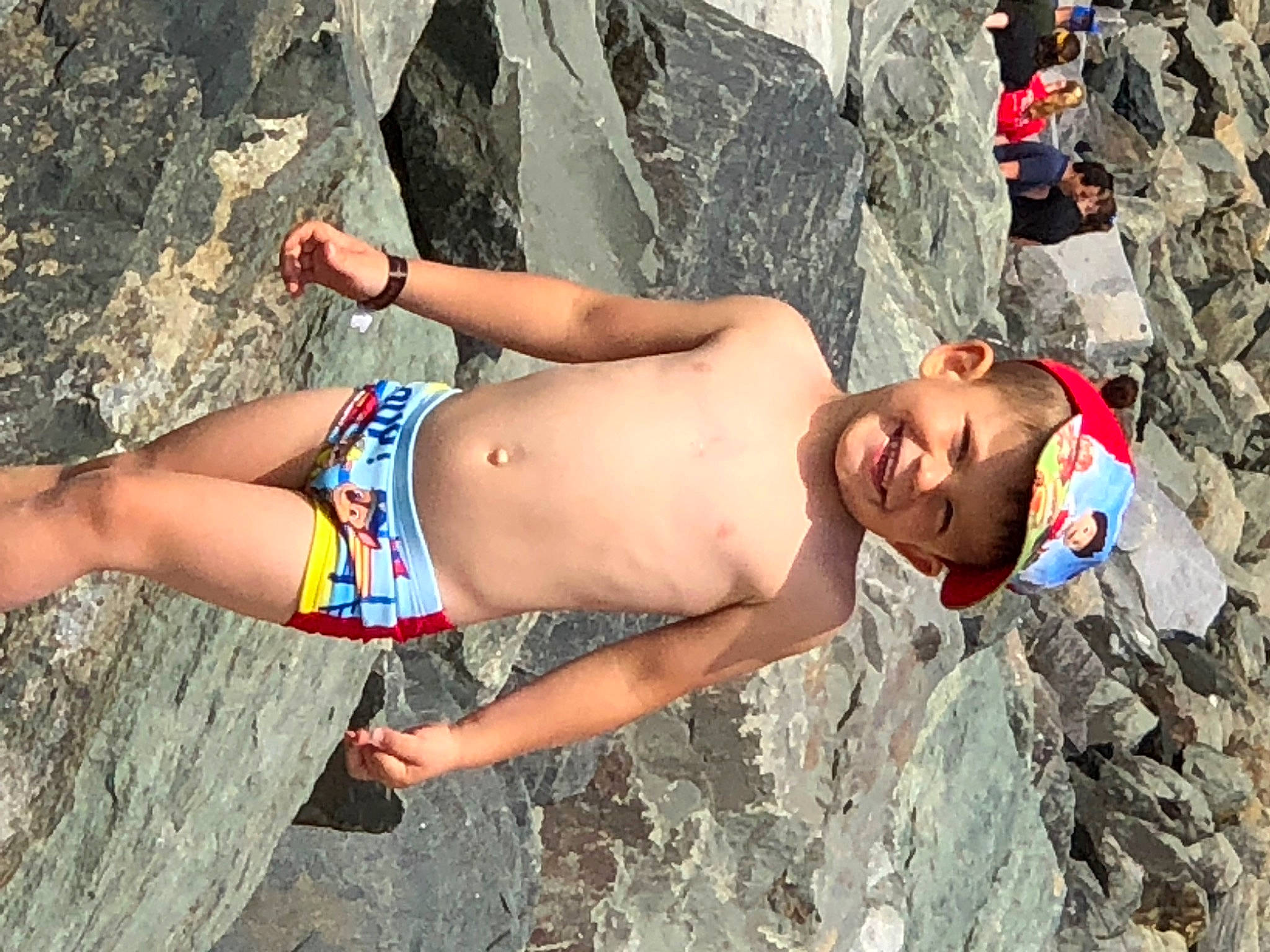 Evann participe au concours pour gagner de l'argent avec cette photo : arm, bedrock, chest, cool, eyewear, fun, hand, human_body, human_leg, joint, joy, leg, leisure, muscle, people_in_nature, person, recreation, swimwear, thigh, trunk