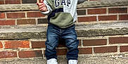 Kyrie joined the competition — help win amazing prizes! brick, casual_clothing, child, concrete, curly_hair, cute, daylight, fashion, front_door, gesture, happy, hoodie, jeans, outdoor, person, portrait, smiling, sneakers, stairs, toddler