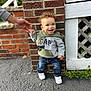 Kyrie joined the competition — help win amazing prizes! child, toddler, smiling, hoodie, jeans, sneakers, hand_holding, brick_wall, sidewalk, outdoor, person, curly_hair, happy, fashion, casual_clothing, daylight, support, young_child, portrait, growth