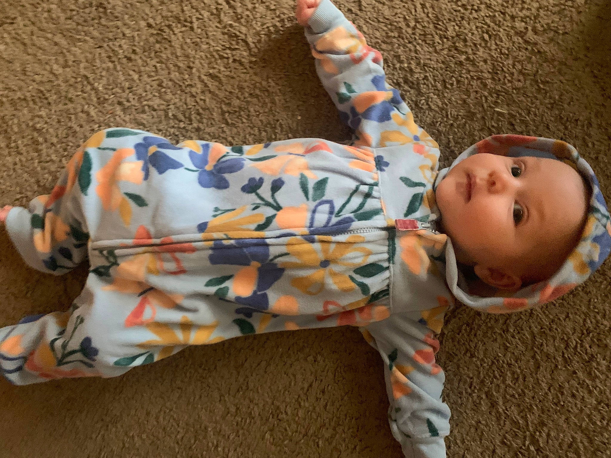 Adelaide is registered to the contest to win money with this photo: baby, baby_products, baby_toddler_clothing, cheek, child, comfort, grass, headgear, human_body, human_leg, linens, mammal, orange, pattern, person, sitting, sleeve, smile, toddler, tree