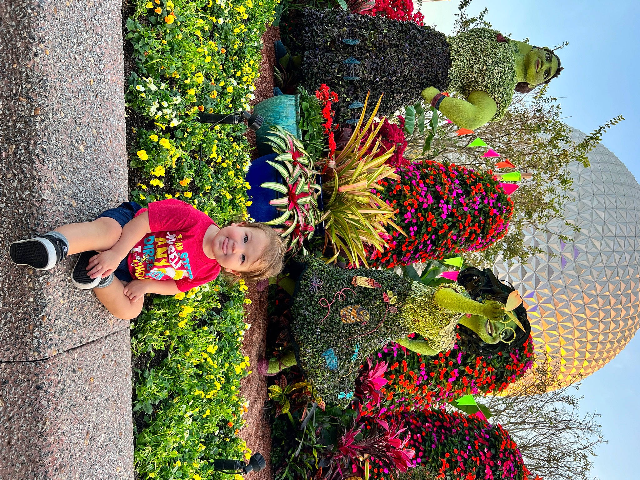 Benjamin is registered to the contest to win money with this photo: art, event, flower, fun, garden, grass, green, happy, joy, lawn_ornament, leaf, leisure, organism, people_in_nature, person, plant, pole, shrub, smile, spring