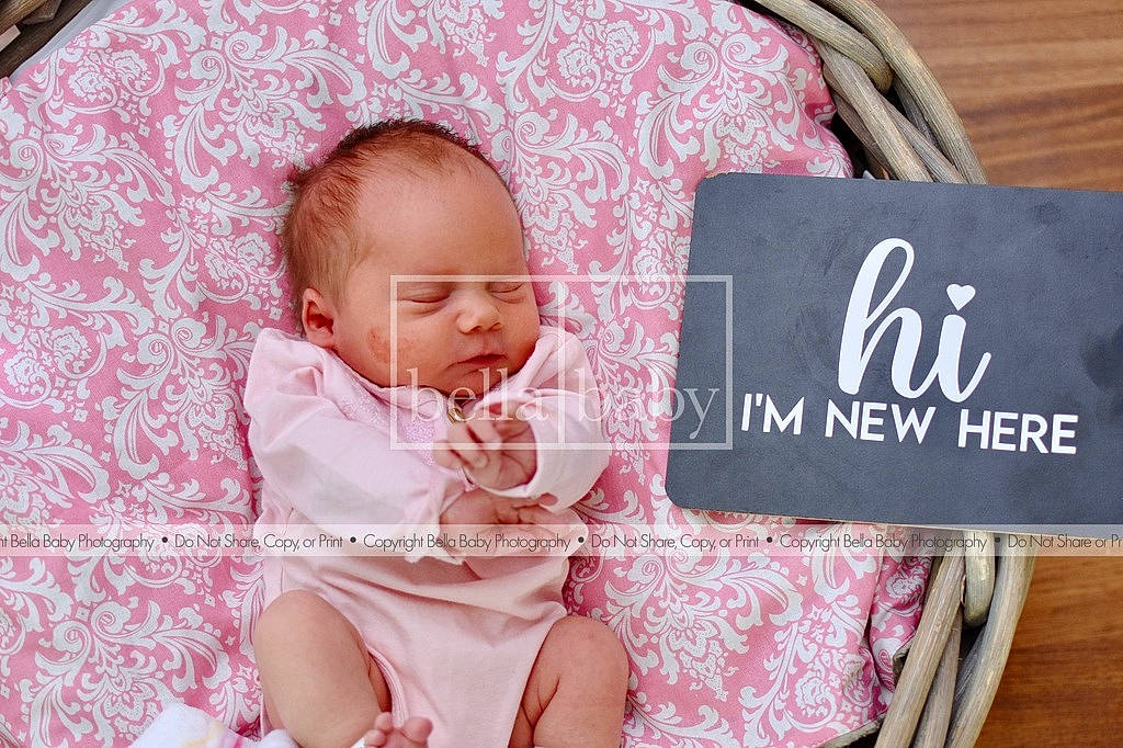 Jayden is registered to the contest to win money with this photo: baby, baby_toddler_clothing, beauty, cheek, comfort, eye, facial_expression, hairstyle, happy, human, linens, magenta, mammal, pattern, person, photograph, pink, room, skin, textile