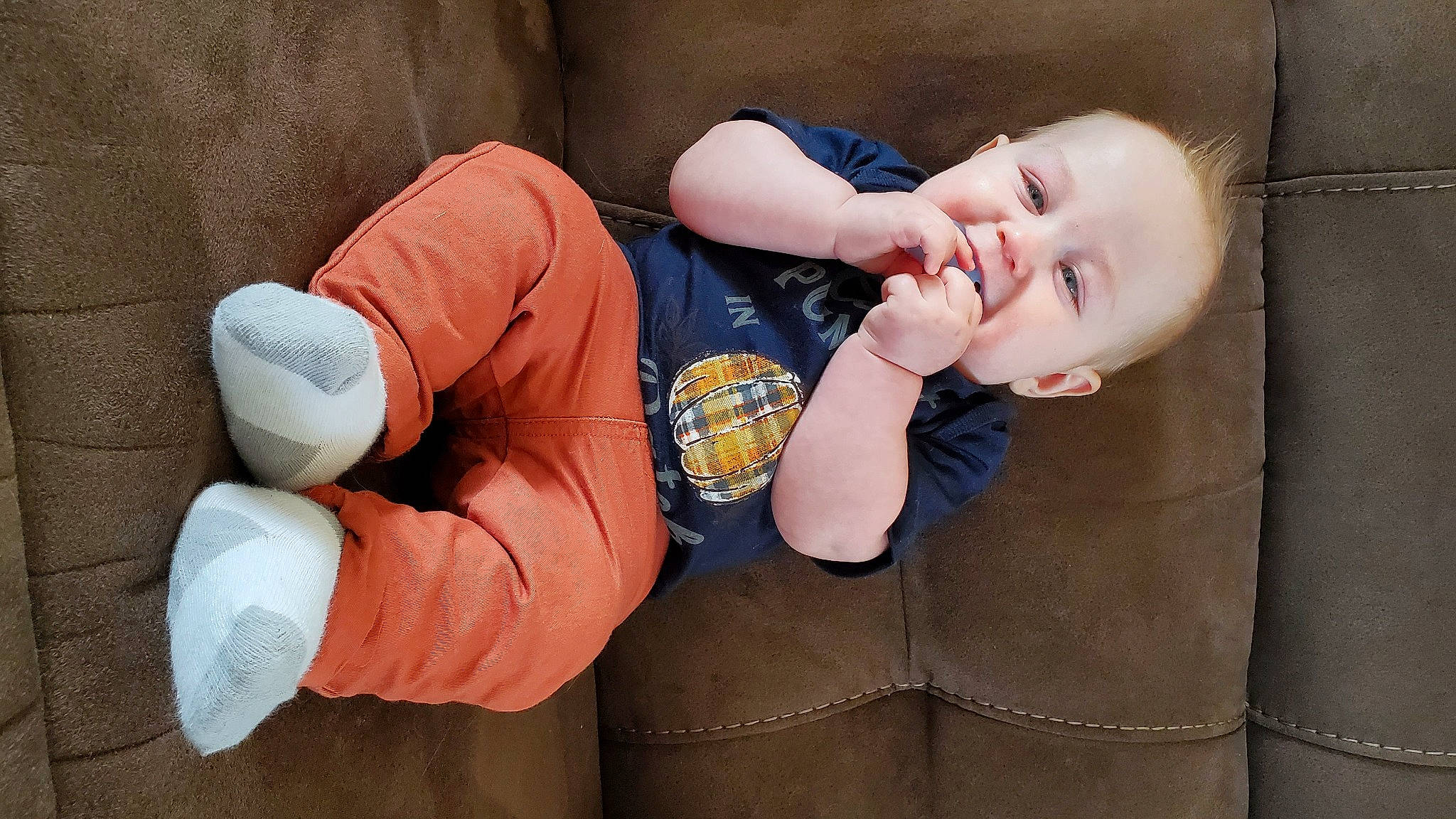 Flynn is registered to the contest to win money with this photo: arm, baby, baby_toddler_clothing, child, comfort, elbow, finger, flash_photography, gesture, hand, happy, human_body, knee, leg, person, skin, sleeve, textile, thigh, thumb
