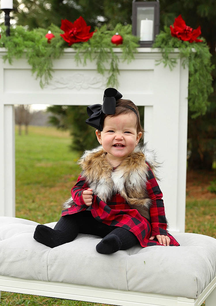 Cathryn is registered to the contest to win money with this photo: comfort, costume_hat, dress, event, fun, fur, grass, happy, holiday, joy, leisure, person, photograph, pink, plant, recreation, red, sitting, smile, toddler