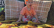 Nova Leigh is registered to the contest to win money with this photo: child, toddler, outdoor, autumn, pumpkin, blanket, hay_bale, orange_bow, smiling, open_mouth, sitting, portrait, sunlight, blue_sky, trees, grass, farm, fall_decor, colorful, cozy