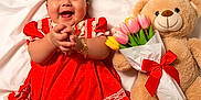 Hallie joined the competition — help win amazing prizes! baby, blanket, bouquet, child, clapping_hands, cute, flower, happy, infant, lace, lying_down, polka_dot, portrait, red_dress, ribbon, smile, soft, teddy_bear, toy, tulips