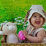 baby, child, smiling, hat, bonnet, toy, stuffed_animal, bunny, basket, flower, greenery, daisy, cute, happy, infant, portrait, playful, indoors, colorful, young