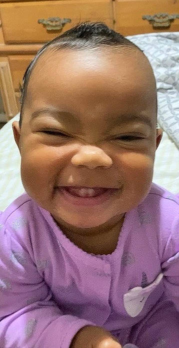 Nylah is registered to the contest to win money with this photo: baby_laughing, cheek, child, chin, ear, eyebrow, forehead, fun, gesture, happy, iris, jaw, joy, lip, mouth, nose, person, pink, skin, smile