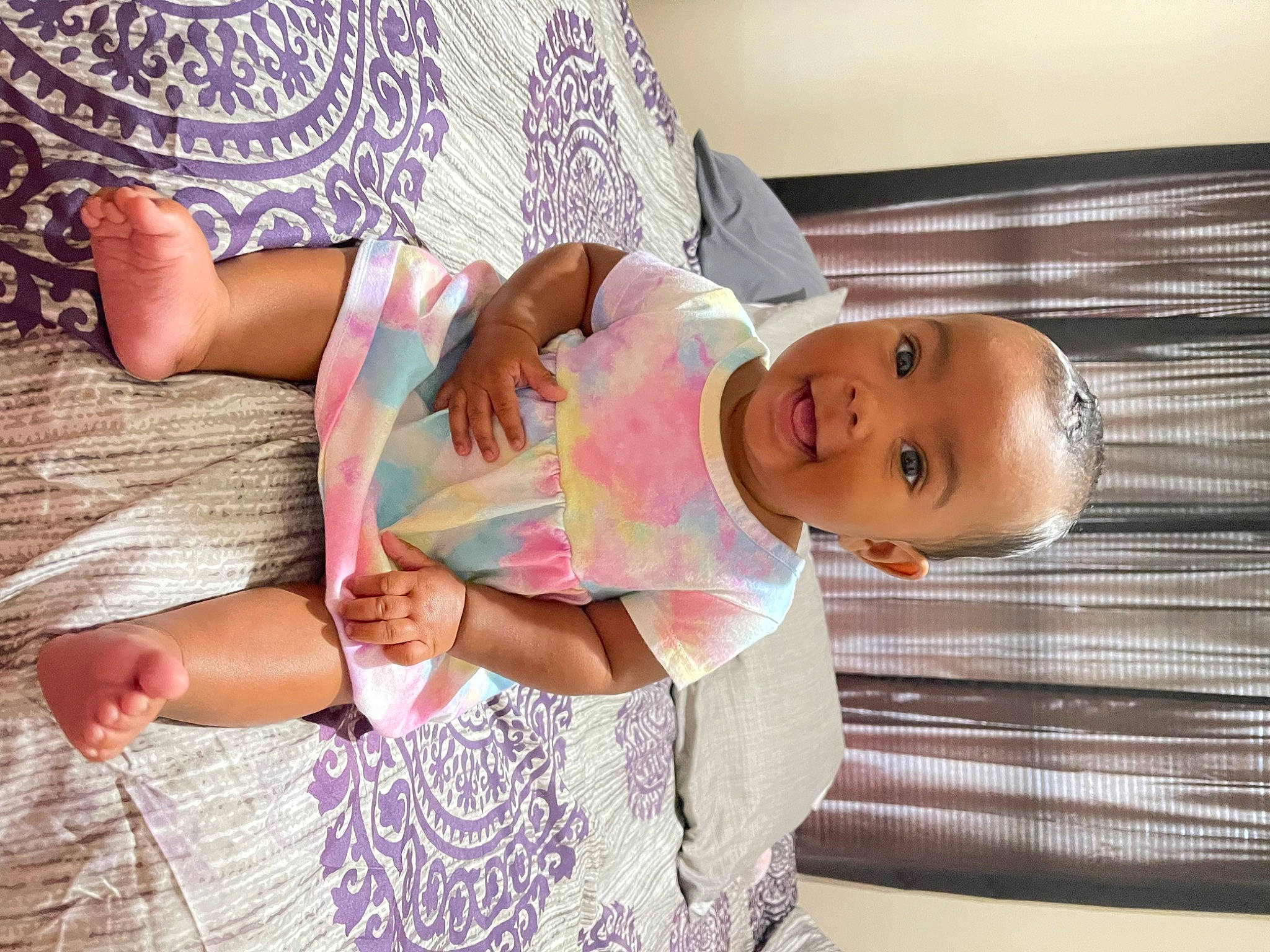 Nylah joined the competition — help win amazing prizes! arm, baby, baby_toddler_clothing, child, clothing, comfort, facial_expression, finger, fun, hand, happy, human_body, leg, pattern, person, pink, skin, sleeve, smile, textile