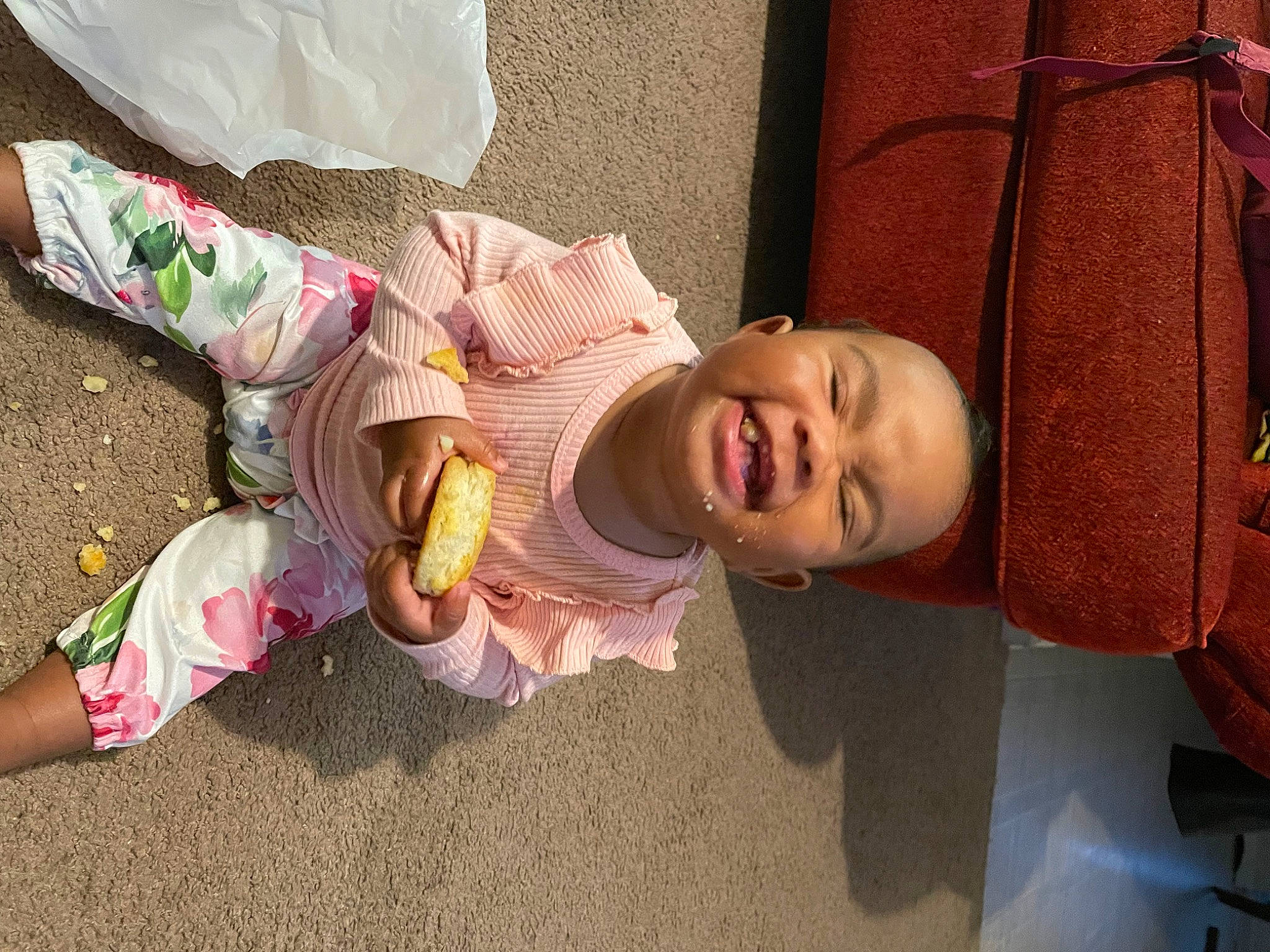 Nylah is registered to the contest to win money with this photo: baby, baby_toddler_clothing, child, comfort, flooring, foot, fun, happy, hat, person, pink, play, room, shoe, sitting, skin, smile, sock, toddler, vacation