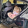 Aria Cataleya joined the competition — help win amazing prizes! baby, car_seat, car, black_car, infant, sleeping, pink_clothing, headband, reflection, person_reflection, open_car_door, wheel, tire, seat, dashboard, steering_wheel, window, side_mirror, road, brick_wall