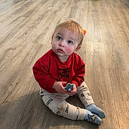 Colter joined the competition — help win amazing prizes! toddler, child, sitting, red_sweatshirt, toy, wooden_floor, indoor, kitchen, refrigerator, curious, pants, socks, flooring, home, childhood, person, young_child, casual_clothing, looking_up, cute