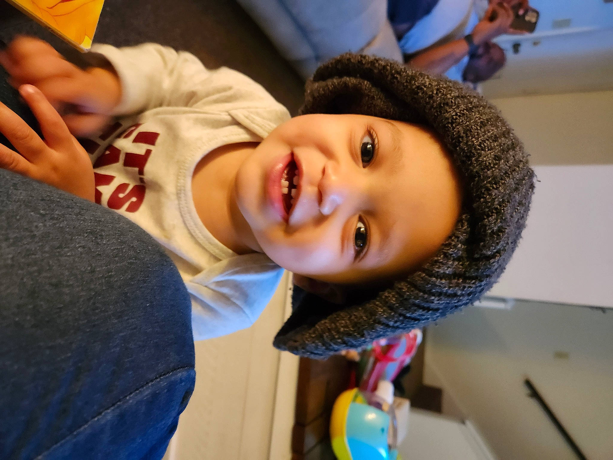 Amari joined the competition — help win amazing prizes! cheek, child, cool, electric_blue, fashion_accessory, fun, gesture, happy, headwear, joy, laugh, leisure, mouth, nose, person, portrait_photography, room, sitting, smile, toddler