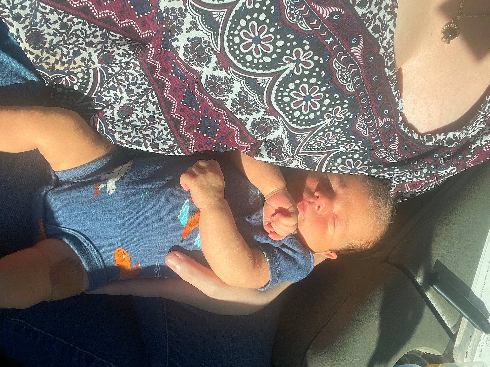 T-rex is registered to the contest to win money with this photo: arm, baby, child, cool, fashion_accessory, finger, fun, gesture, hand, hat, headgear, human_leg, magenta, pattern, person, sleeve, sun_hat, thigh, toddler, vehicle_door