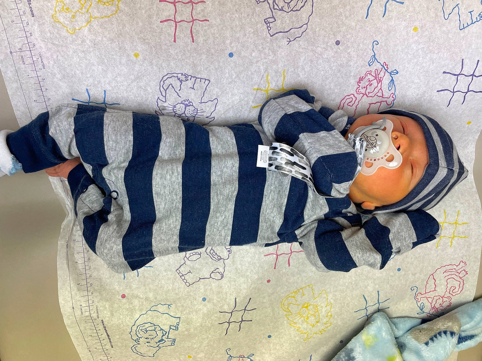 T-rex is registered to the contest to win money with this photo: baby_products, baby_sleeping, baby_toddler_clothing, bedding, creative_arts, fashion_accessory, font, home_accessories, human_leg, linens, pattern, person, pillow, rectangle, room, sleeve, textile, thigh, throw_pillow, visual_arts