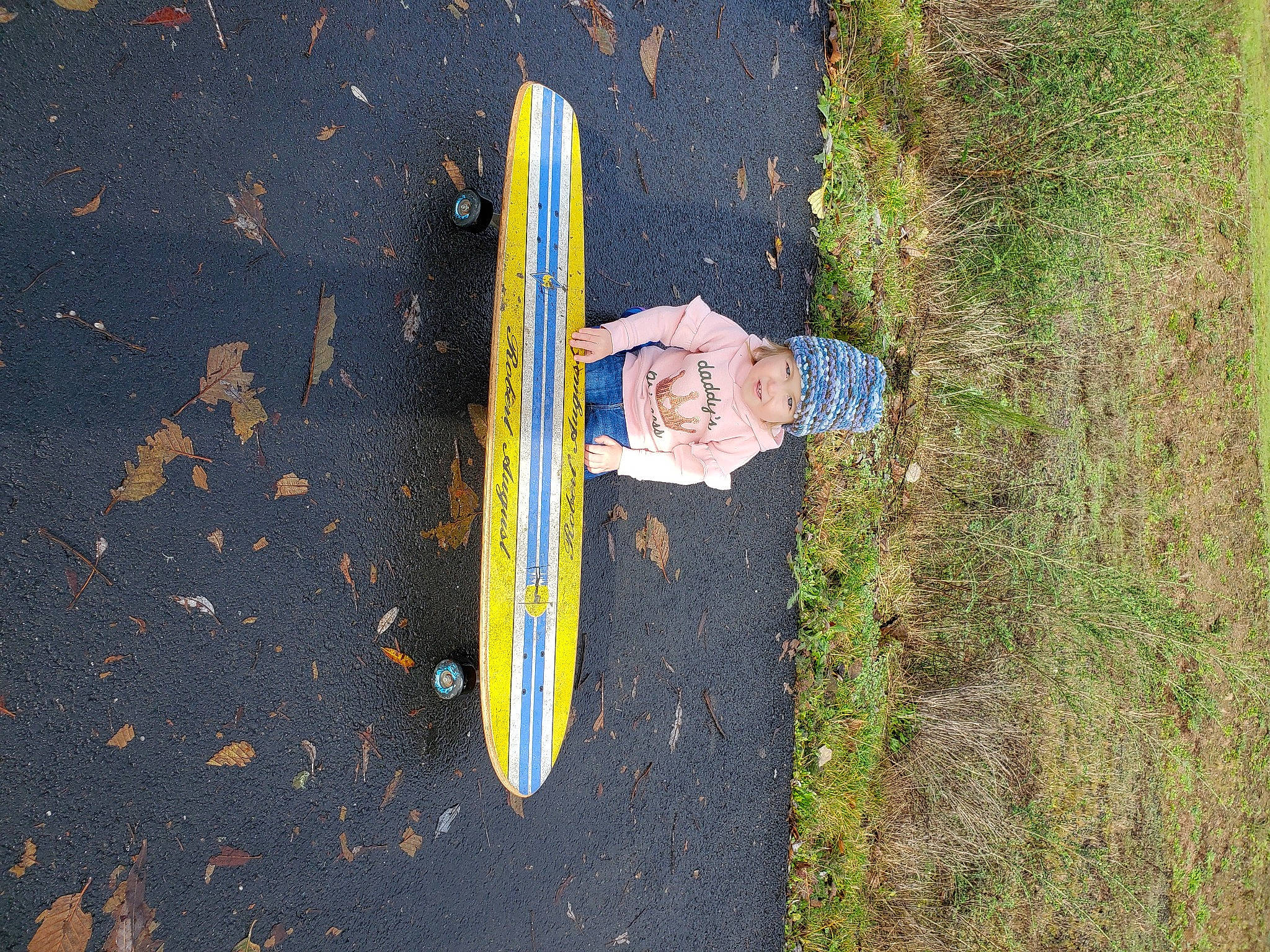 Carmella joined the competition — help win amazing prizes! boardsport, headwear, people_in_nature, person, surfboard, surfboard_fin, surfing, surfing_equipment, walking_shoe