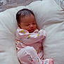 Laysia is registered to the contest to win money with this photo: baby, blanket, child, cozy, cushion, cute, face, floral_pattern, head, indoors, infant, newborn, onesie, peaceful, pink_clothing, resting, sleeping, small, soft, wrapped