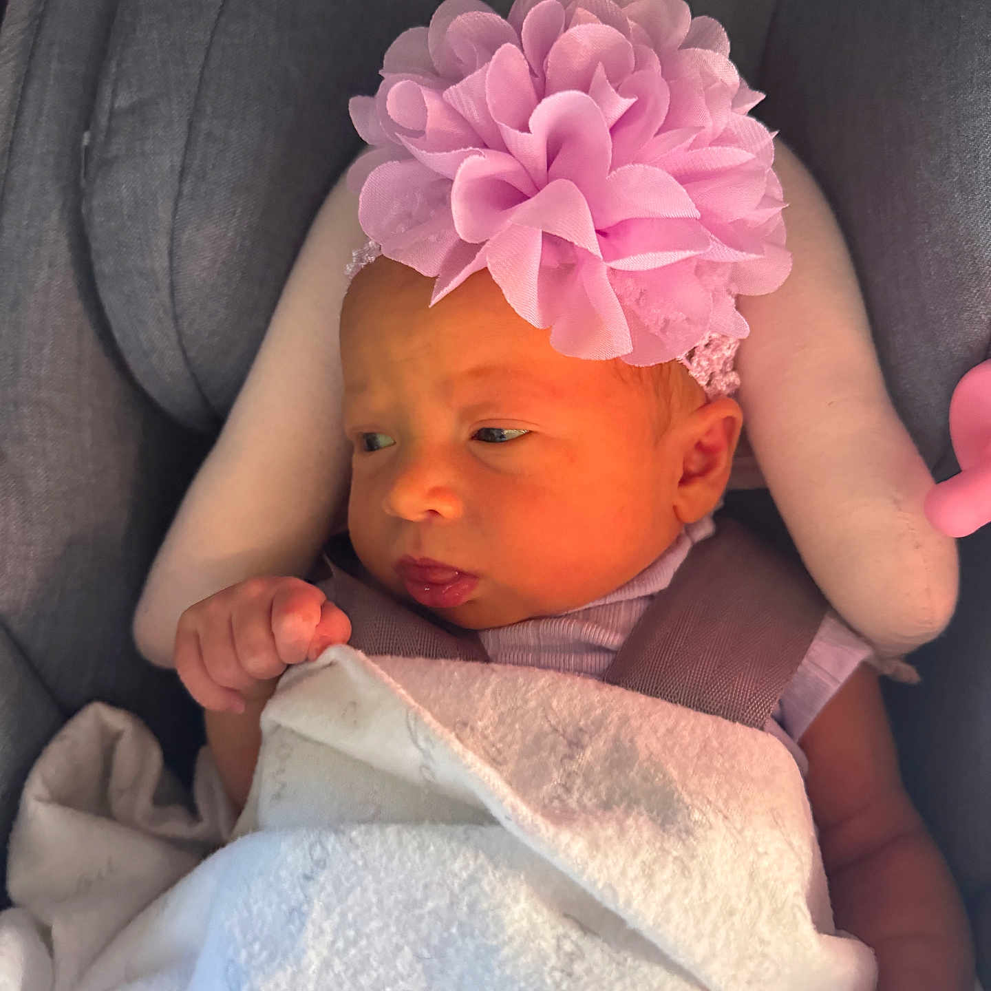 Pyper joined the competition — help win amazing prizes! baby, baby_girl, blanket, car_seat, child, clothing, cushion, cute, face, headband, indoors, infant, newborn, pink_flower, portrait, resting, skin, sleepy, small_hand, soft_light