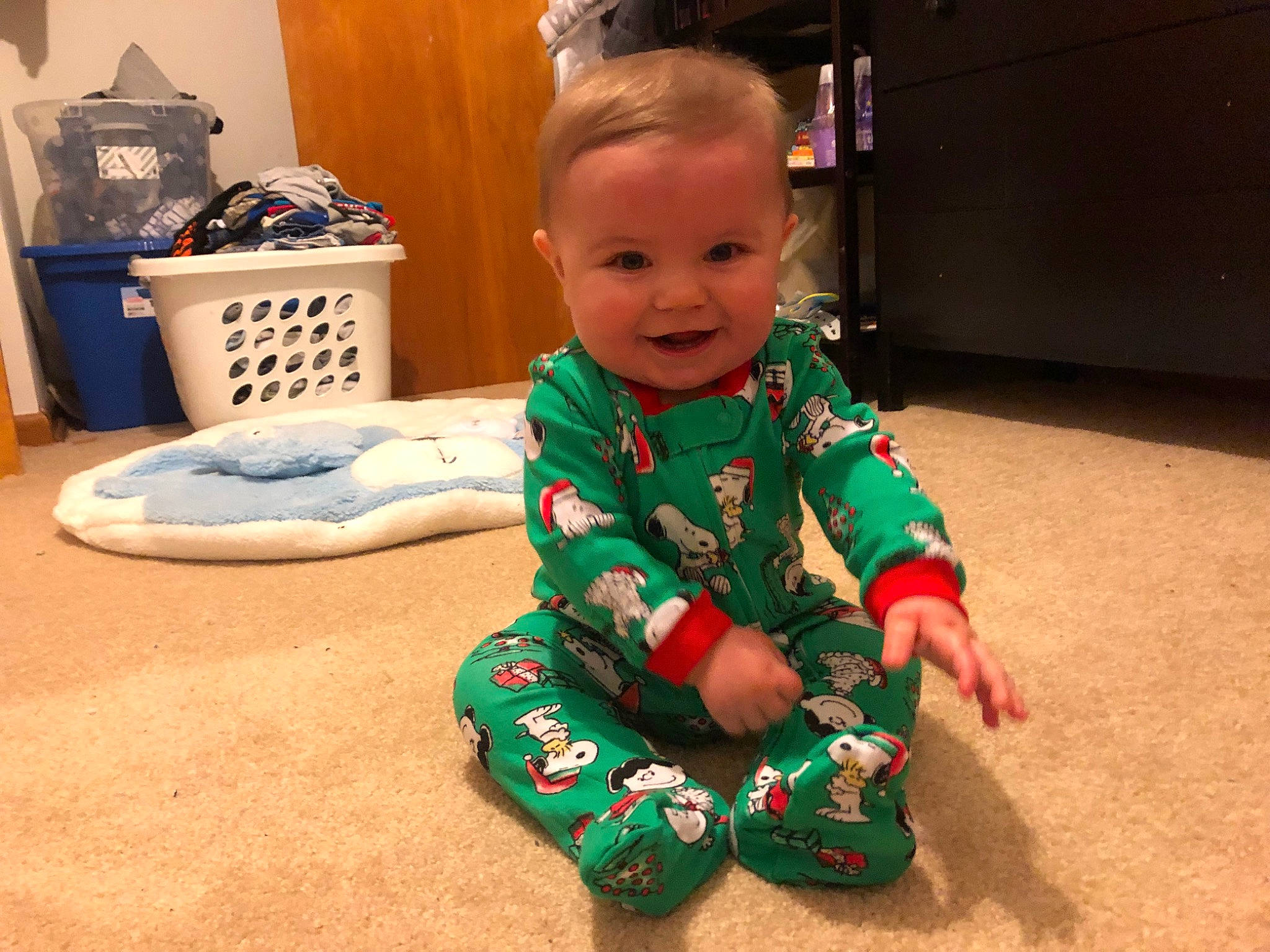 Chevy is registered to the contest to win money with this photo: baby, baby_toddler_clothing, child, dress, face, floor, flooring, fun, hair, happy, head, human_body, person, play, room, sitting, sleeve, smile, t_shirt, toddler