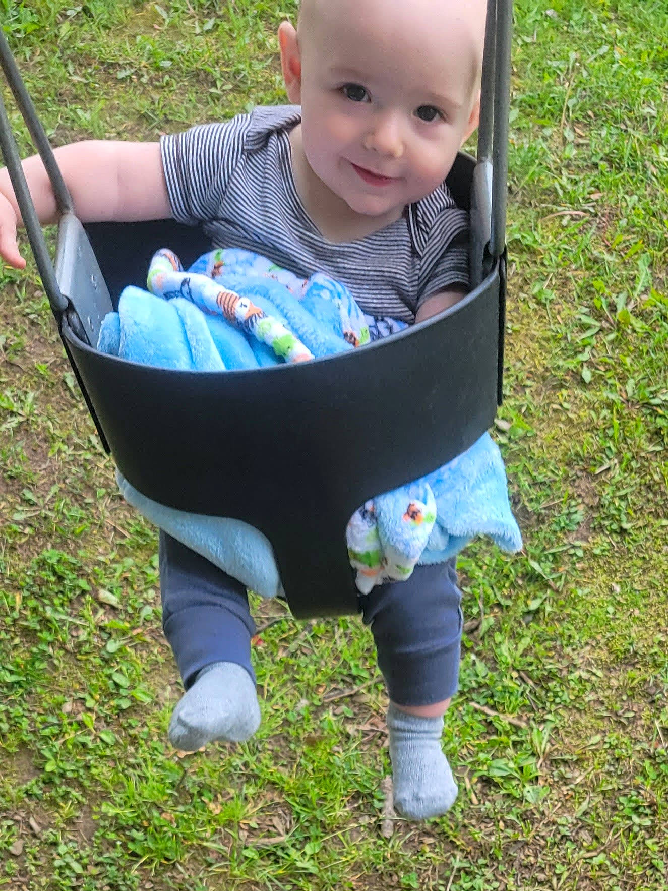 Emerson is registered to the contest to win money with this photo: baby, baby_products, baby_toddler_clothing, chair, child, comfort, fun, garden, grass, happy, joy, lawn, leisure, outdoor_furniture, pattern, people_in_nature, person, sitting, sleeve, smile