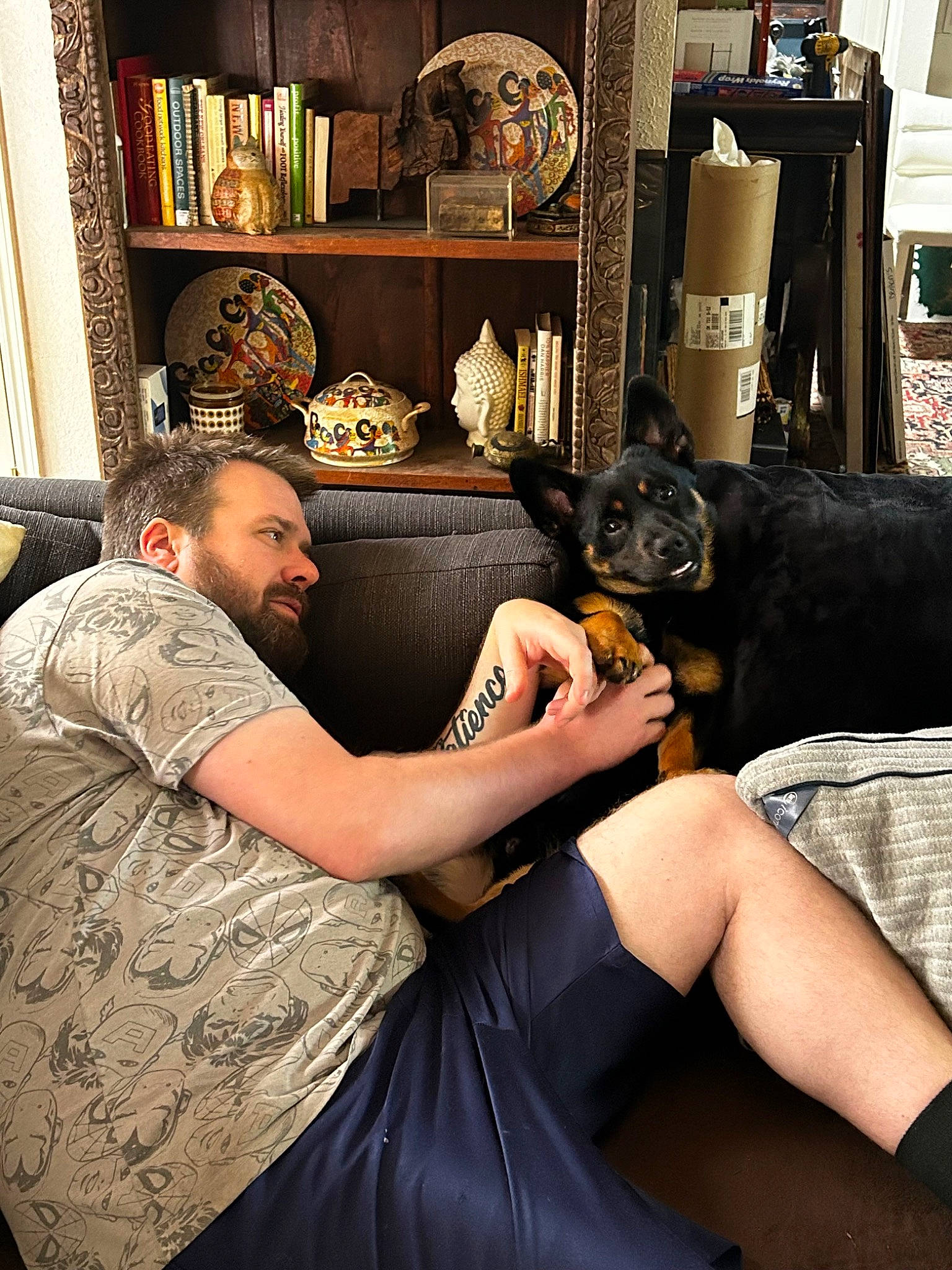 Bear Bear is registered to the contest to win money with this photo: beauty_salon, black_hair, bookcase, comfort, cool, eyewear, hairstyle, human_leg, joint, knee, lap, picture_frame, shelf, shelving, shoulder, tattoo, tattoo_artist, textile, thigh, wrist