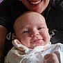 Julia is registered to the contest to win money with this photo: baby, adult, smiling, glasses, closeup, portrait, happy, face, hand, clothing, infant, person, cute, indoor, family, tender, joy, warmth, skin, love
