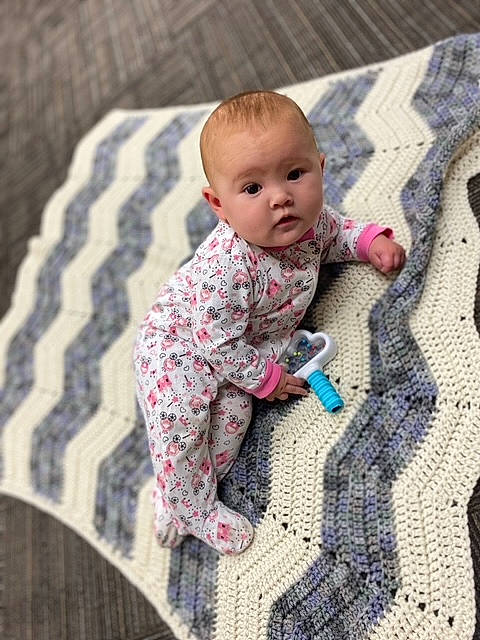 Alicia joined the competition — help win amazing prizes! baby, baby_toddler_clothing, carpet, child, comfort, eye, floor, flooring, fun, grey, linens, outerwear, pattern, person, pink, sitting, skin, sleeve, textile, toddler