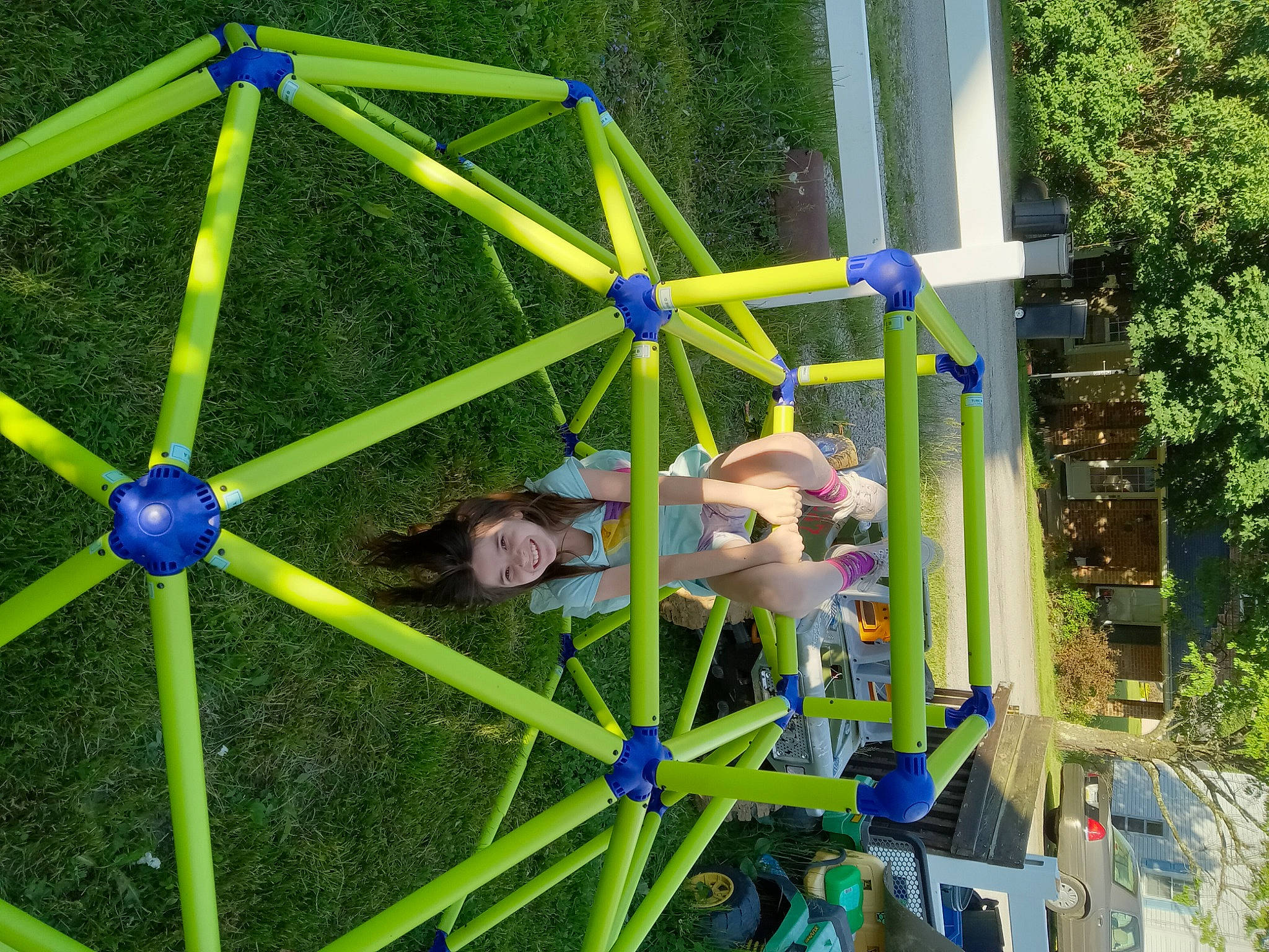 Morganna is registered to the contest to win money with this photo: amusement_ride, automotive_wheel_system, botany, circle, city, electric_blue, fun, garden, grass, joy, lawn, leisure, outdoor_play_equipment, person, plant, playground, pole, recreation, symmetry, tree