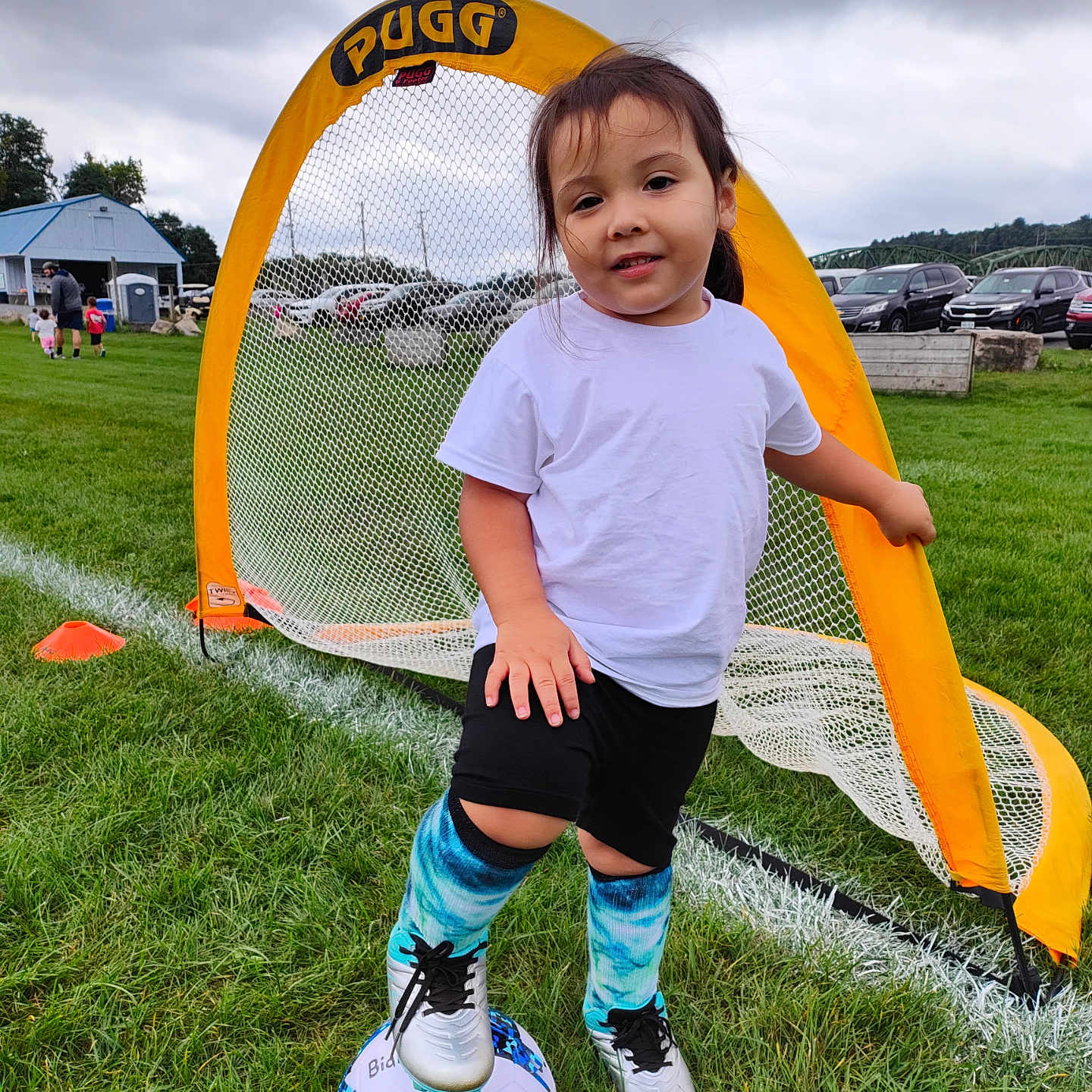 Bianca joined the competition — help win amazing prizes! ball, boy, car, child, clothing, football, footwear, grass, male, person, plant, shoe, shorts, sneaker, soccer, soccerball, sphere, sport, transportation, vehicle