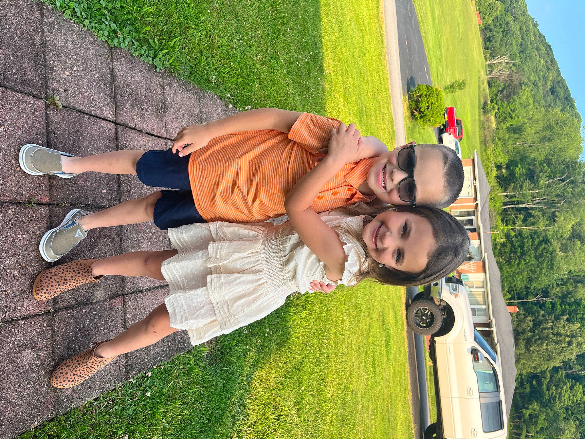 Shalyn joined the competition — help win amazing prizes! car, fun, glasses, grass, green, happy, human_leg, joy, lawn, leg, leisure, people_in_nature, person, plant, recreation, shorts, sky, sneakers, sunglasses, thigh